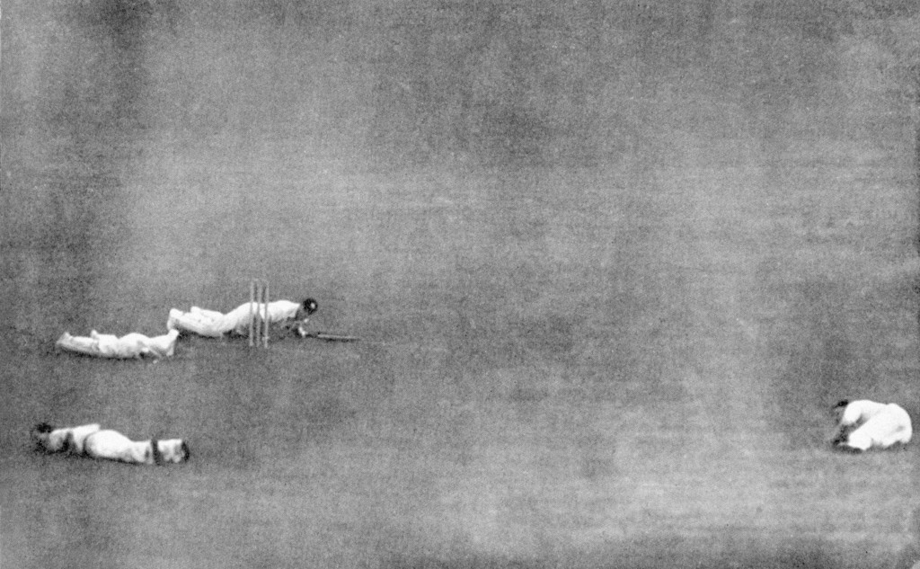 Army v RAF - Lord's Cricket Ground - London - 1944. Players hit the deck as a V1 flying-bomb falls in the vicinity of Lord’s; Army’s Jack Robertson (batting), RAF’s Andy Wilson (wicketkeeper), Bill Edrich (bottom l) and Austin Matthews (r).