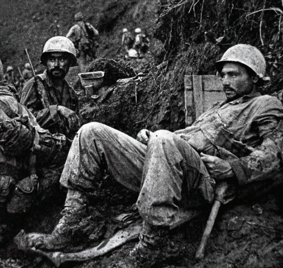 US Marines rest during the ferocious fighting on Okinawa, the first Japanese island to be invaded. How many would die in a land battle for the whole country?