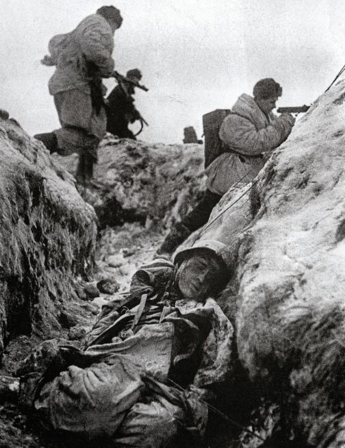 Red Army infantry storm forwards across a German trench during the Siege of Leningrad. 