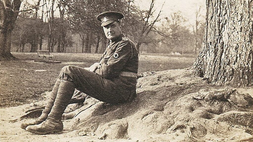 Ralph Vaughan Williams in uniform, sitting under a tree in 1915.