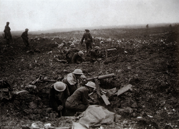 Canadian machine-gunners make use of shell-holes as emplacements. 