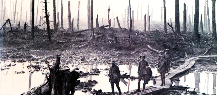 British soldiers cross the waterlogged Passchendaele battlefield.