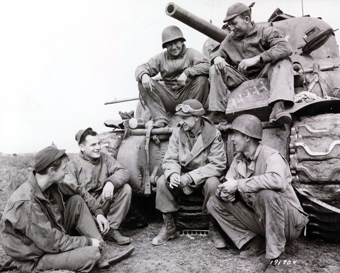 Black and white photograph of Ernie Pyle with the 191st Tank Battalion at Anzio in 1944.