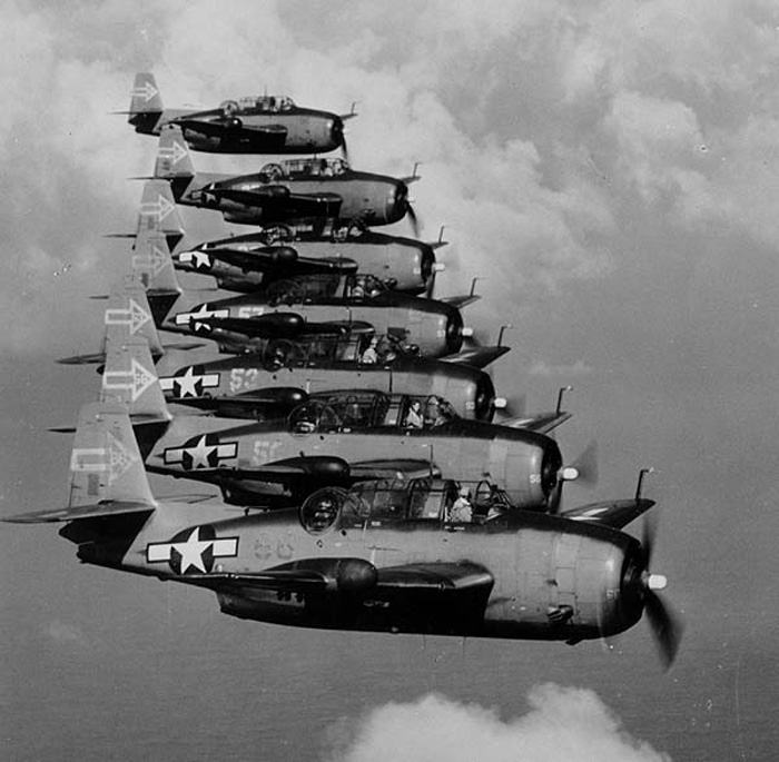 A squadron of Grumann Avenger torpedo-bombers in flight. 