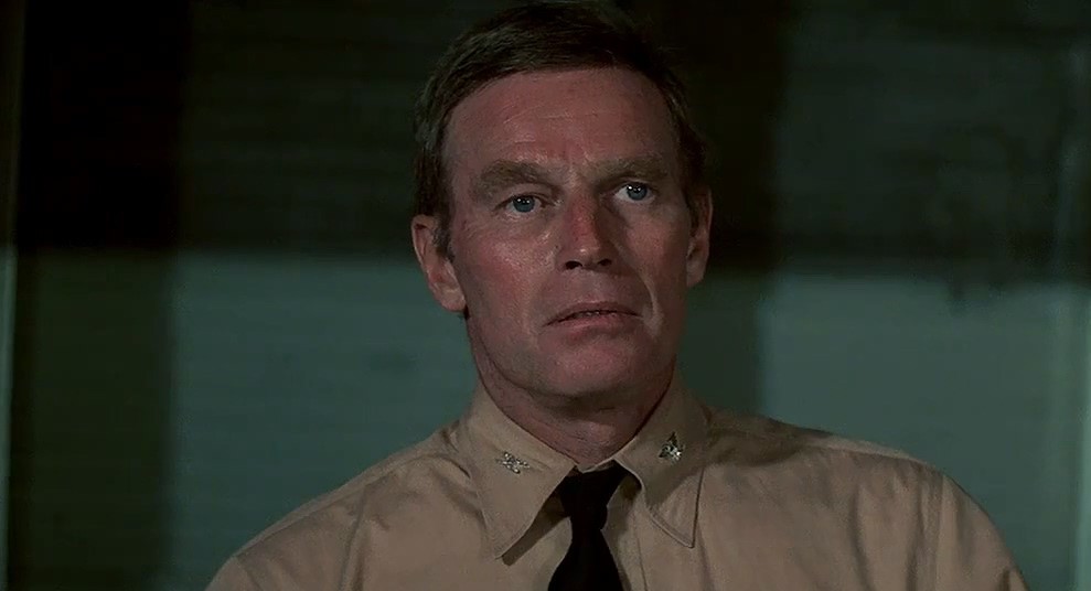 Charlton Heston as Captain Matt Garth in the 1976 version.