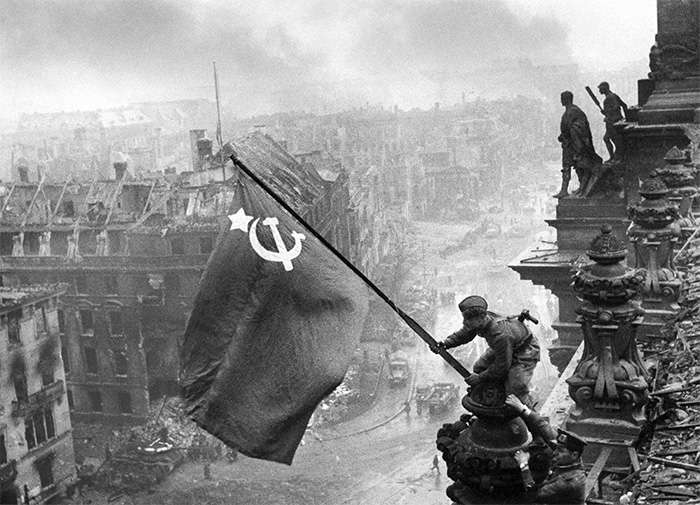 A propaganda image depicting Soviet soldiers raising the Red Flag on the Reichstag. It has since become one of the most recognisable images of the taking of Berlin.