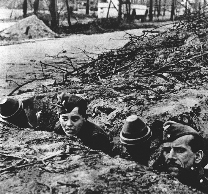 One of the most-famous pictures from the Battle of Berlin – two Volkssturm recruits, young and old, await the Soviets in a trench armed with Panzerfausts, the short-range, single-use, anti-tank rocket.