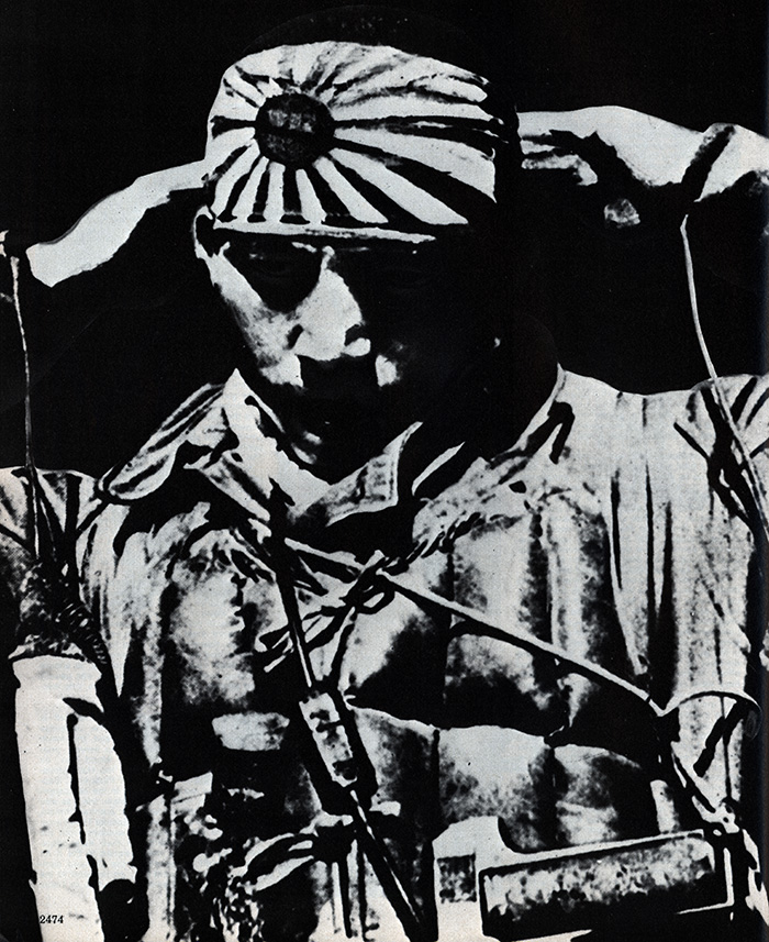 A kamikaze pilot fastens his bandana before setting out.