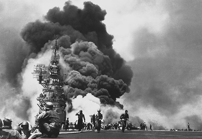 The USS Bunker Hill burns after two kamikaze strikes in 30 seconds.